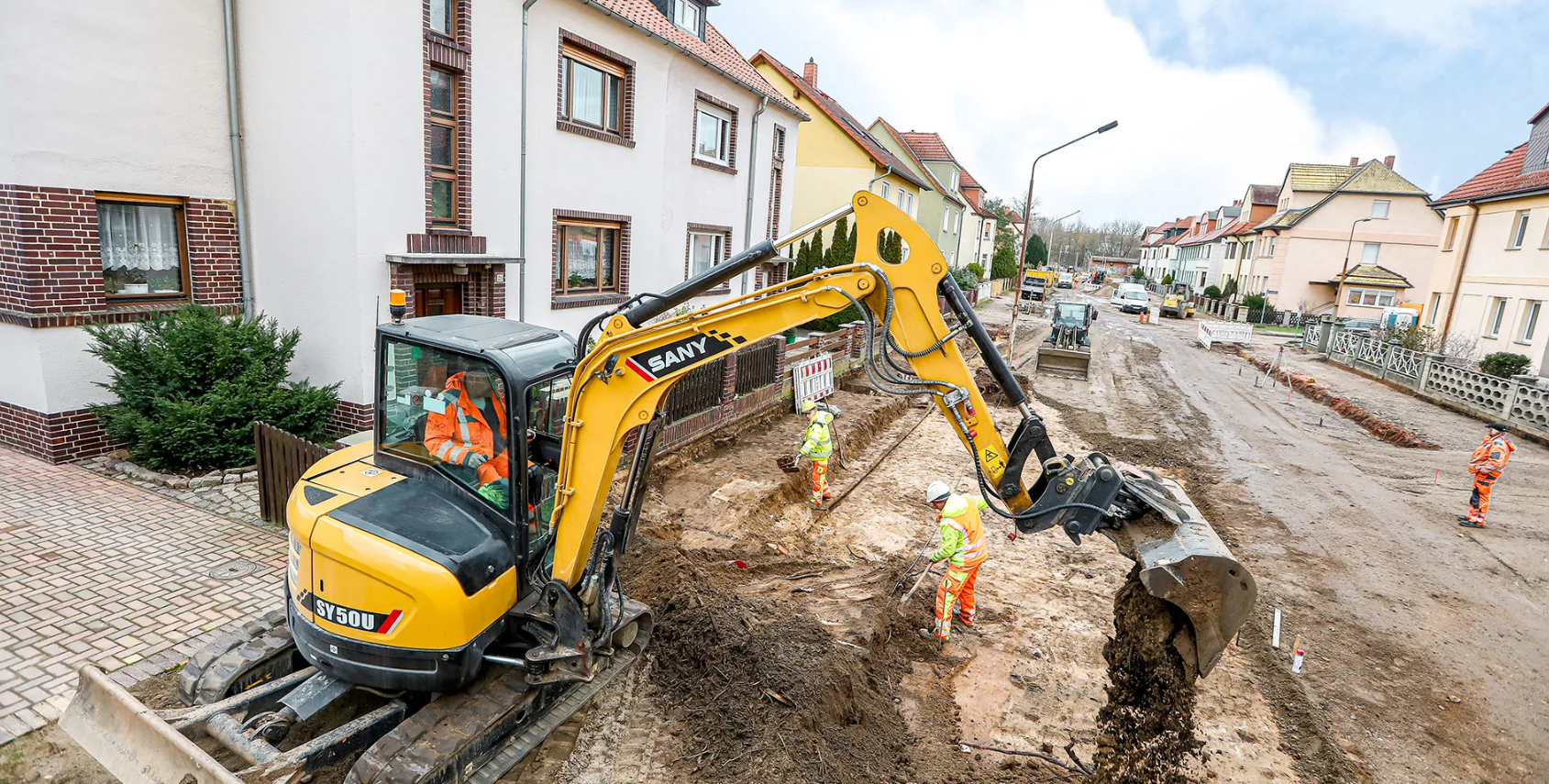 Excavator working on the street