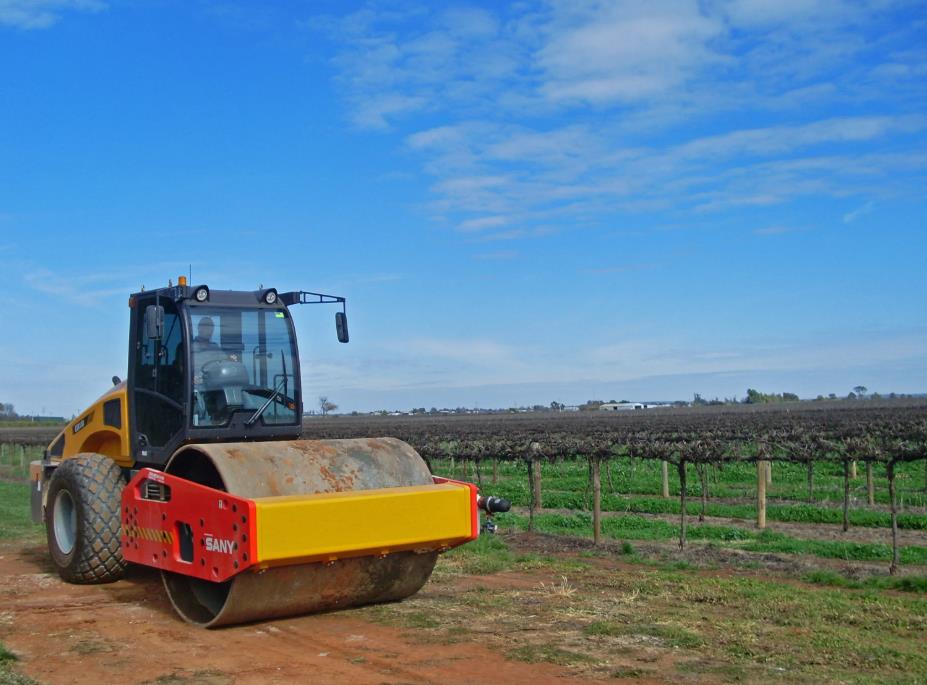 Road roller working on road construction