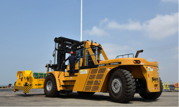 The staff is about to operate the forklift