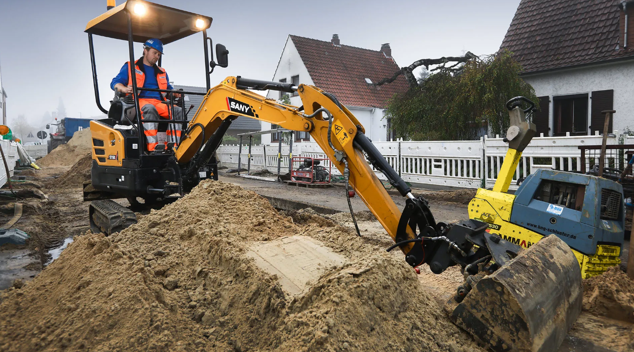 A SANY mini excavator digging earth